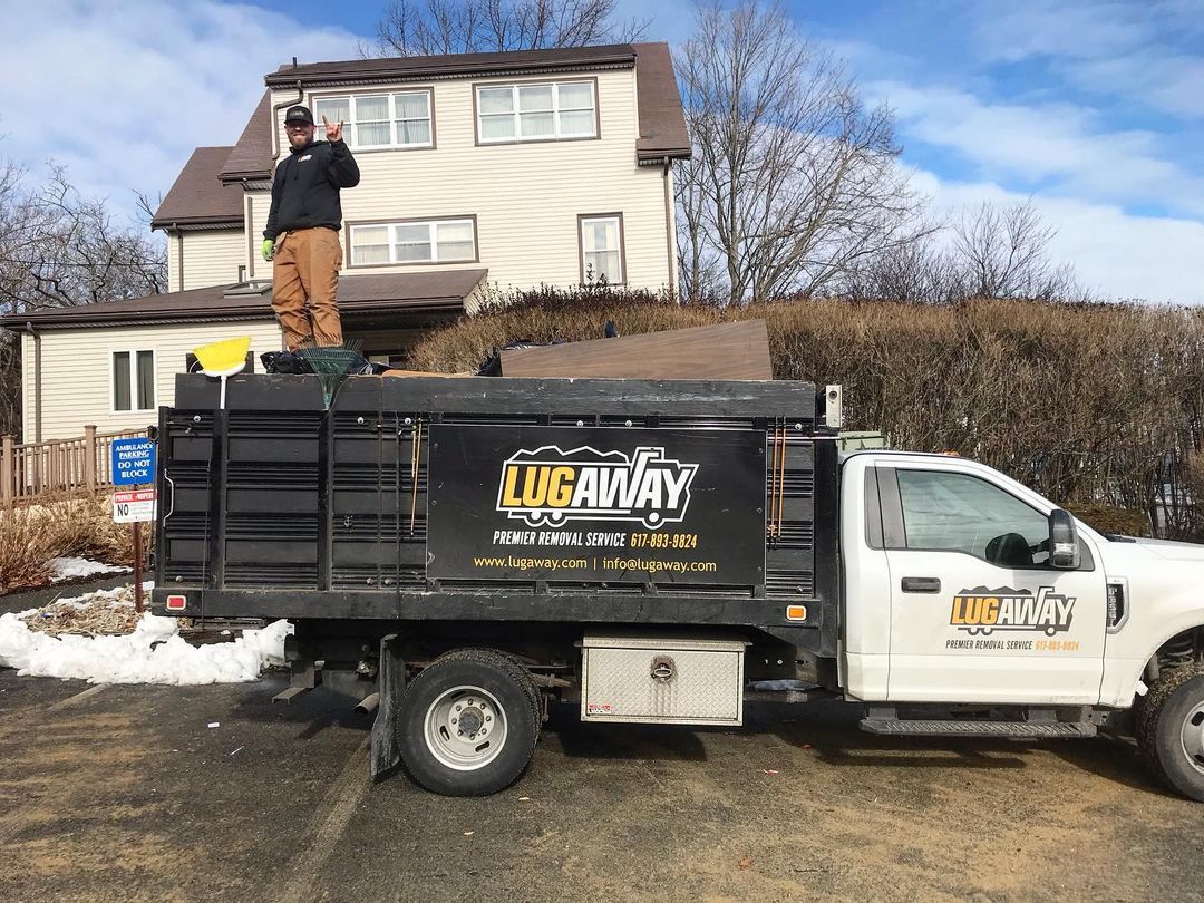 A Lug Away Junk Removal and Demolition expert performing junk removal services