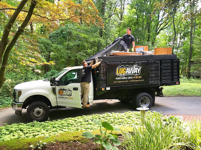 A Lug Away junk truck hauling junk