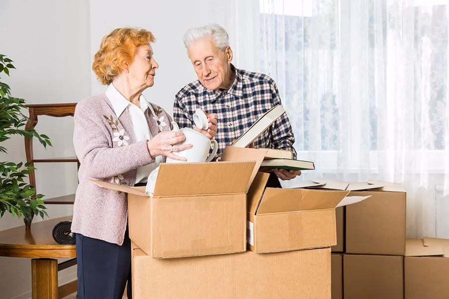Senior downsizing junk removal helping an elderly homeowner declutter